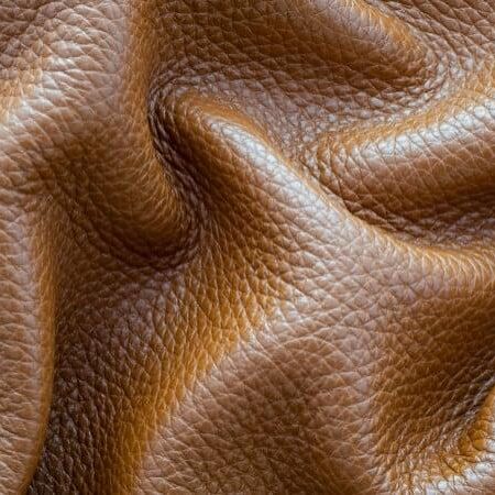 Close-up of real leather showing soft wrinkles and fold lines